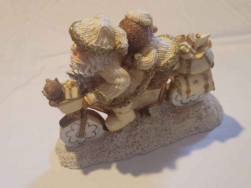 Santa and Teddy statue