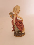 Group of 4 Vintage Depose Figurines