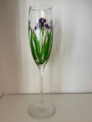 Clear glass wine glass with floral design on a white background
