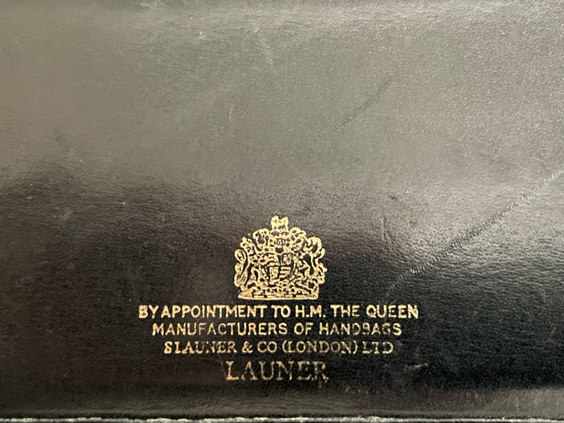 Launer, black leather six card holder with gold plated corners