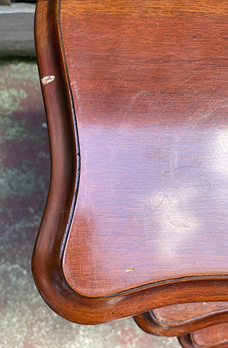 Close-up of a wooden surface with visible wear and tear