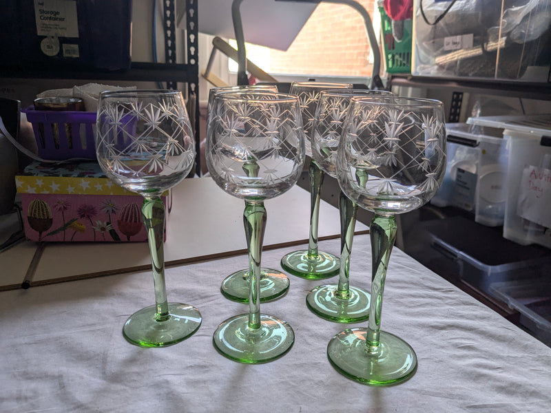 vintage tall wine glass with green stem and foot